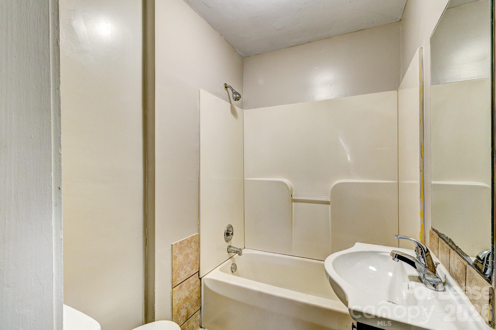 1006 Delview Road Cherryville, NC 28021 - Photo 10 of 10 a bathroom with a tub and a sink