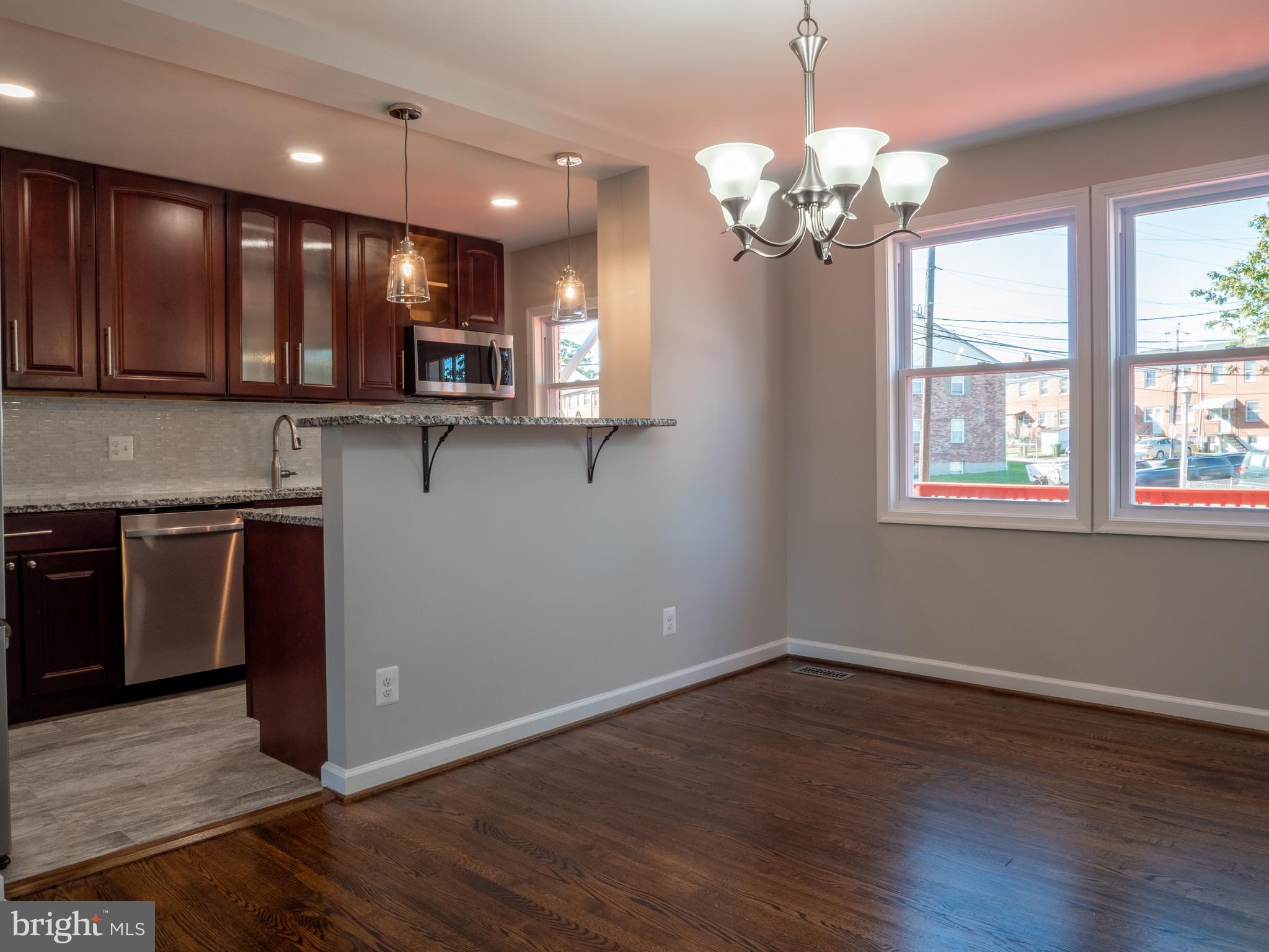 1304 Kitmore Road Baltimore, MD 21239 - Photo 7 of 29 Dining Room open to kitchen with breakfast bar