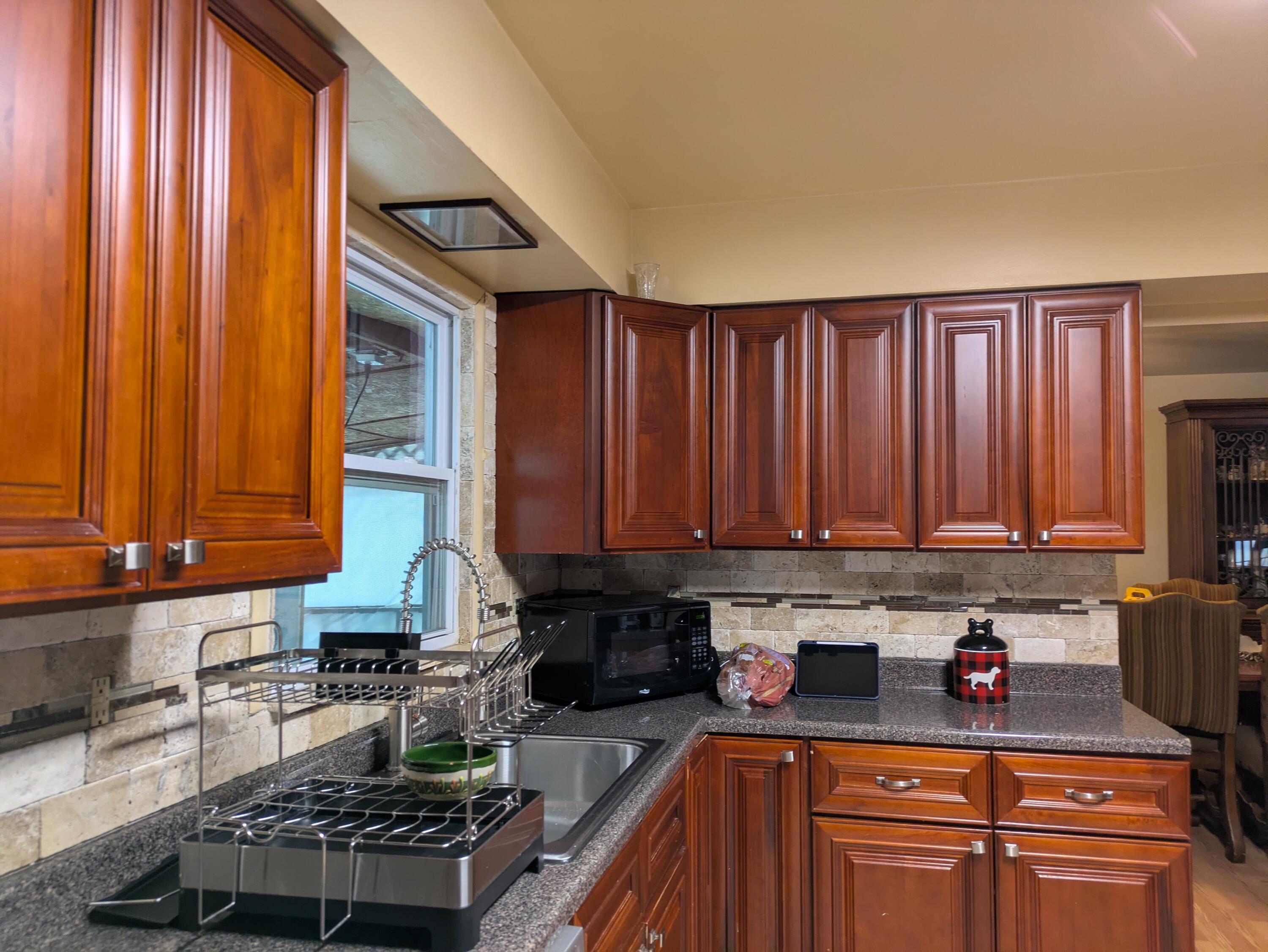 23180 Whitcomb Street Lowell, IN 46356 - Photo 13 of 22 a kitchen with stainless steel appliances granite countertop a stove a sink dishwasher and cabinets with wooden floor