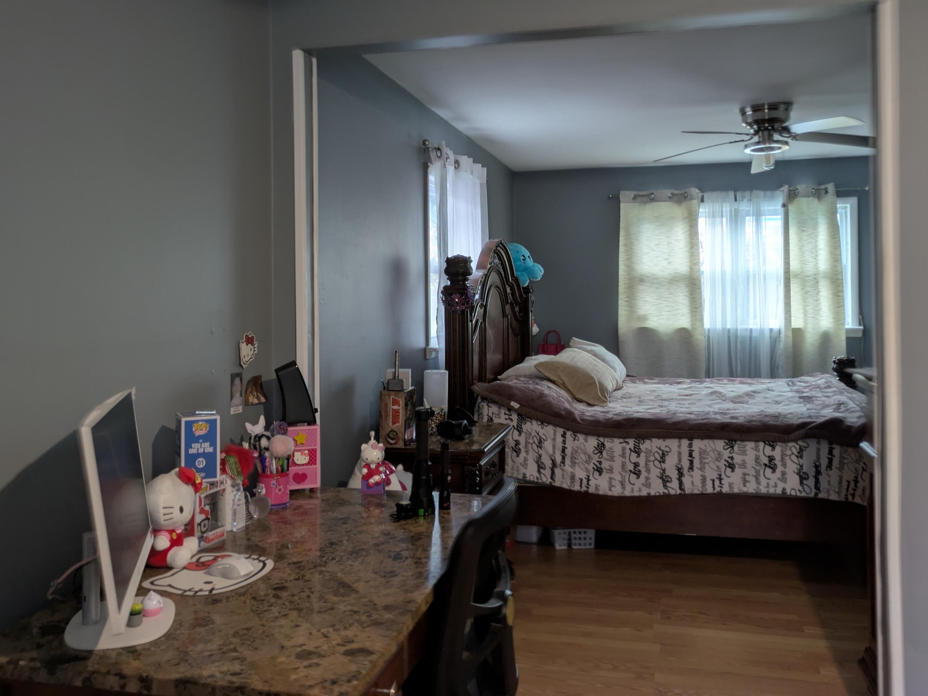 23180 Whitcomb Street Lowell, IN 46356 - Photo 16 of 22 a bedroom with bed and wooden floor