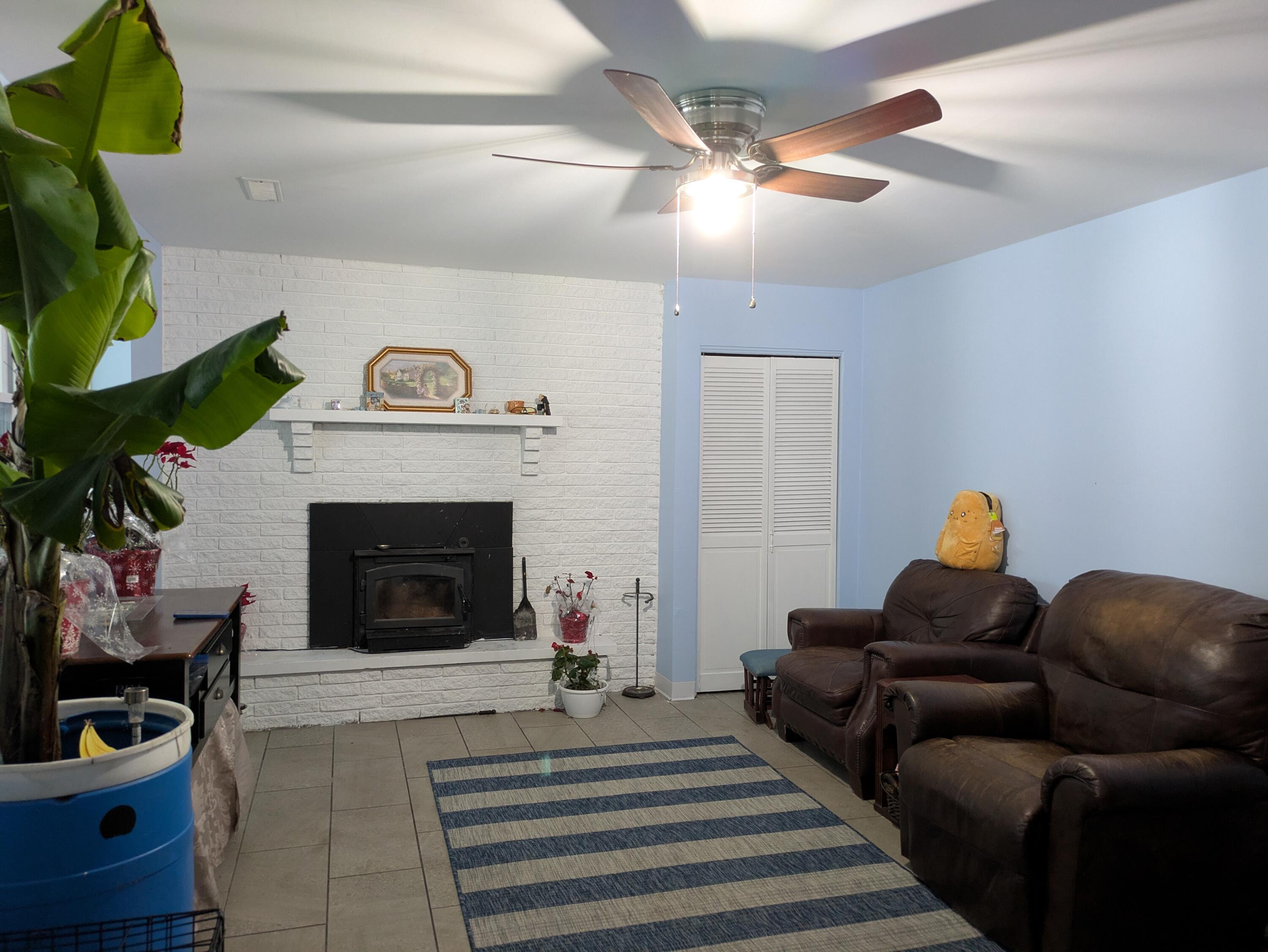 23180 Whitcomb Street Lowell, IN 46356 - Photo 5 of 22 a living room with furniture and a fireplace