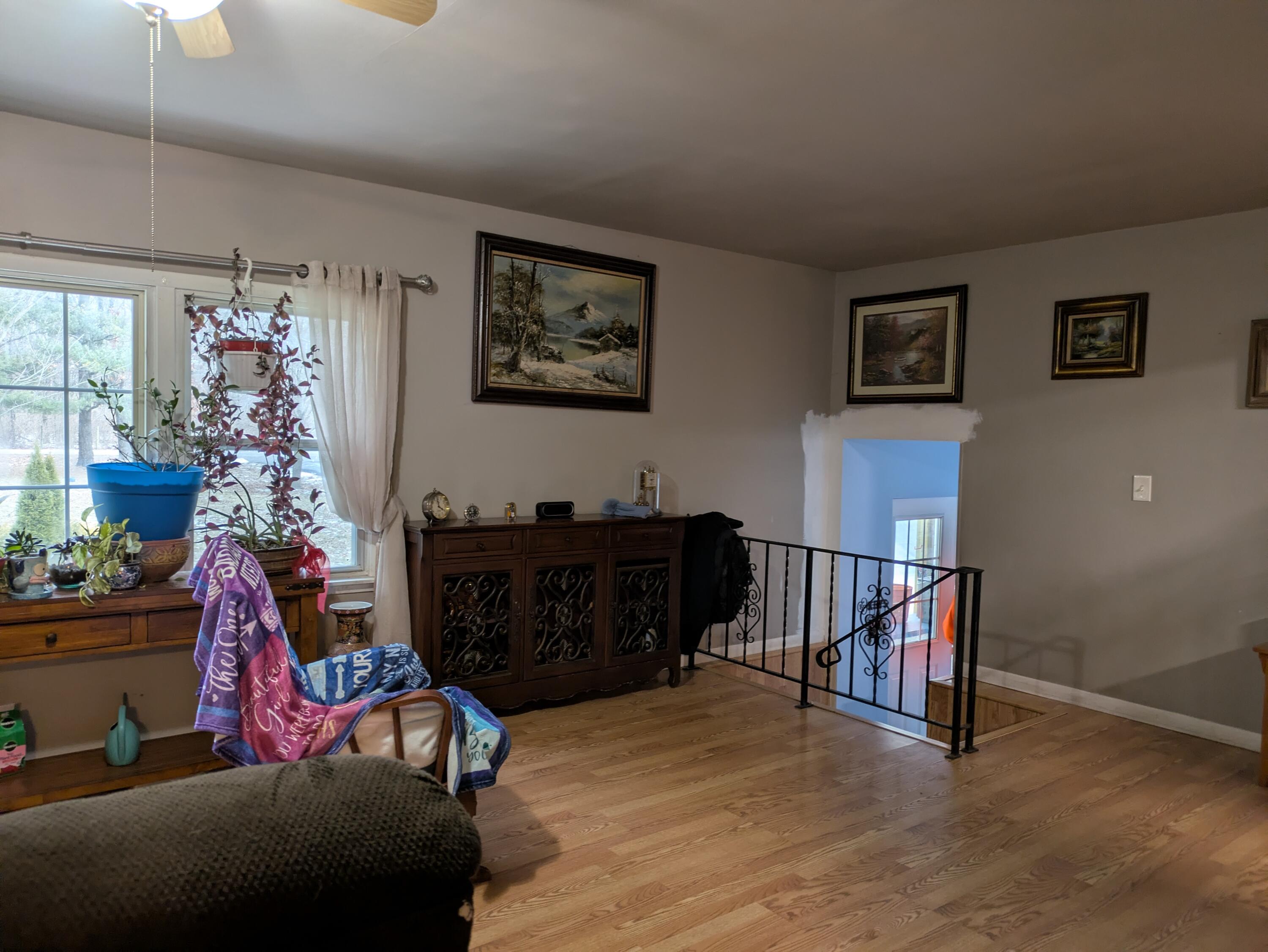 23180 Whitcomb Street Lowell, IN 46356 - Photo 8 of 22 a living room with furniture and a potted plant