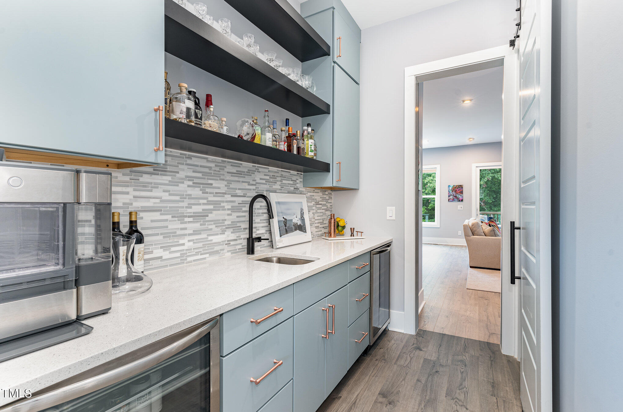 183 Post Oak Road Chapel Hill, NC 27516 - Photo 14 of 51 a hallway with sink and wooden floor