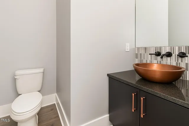 a bathroom with a toilet a sink and bathtub
