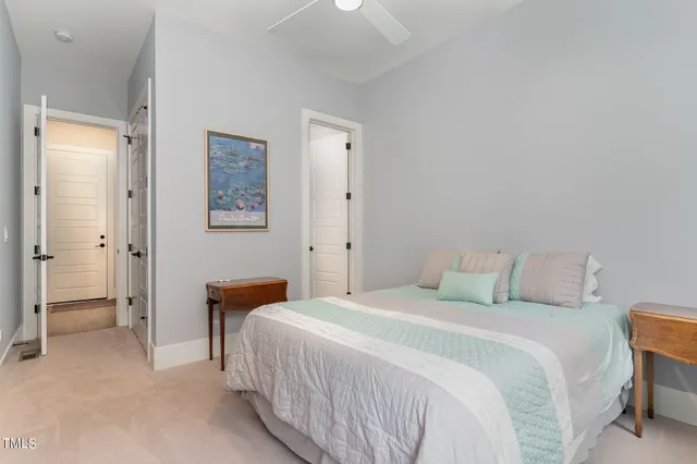 a bedroom with a bed and a table