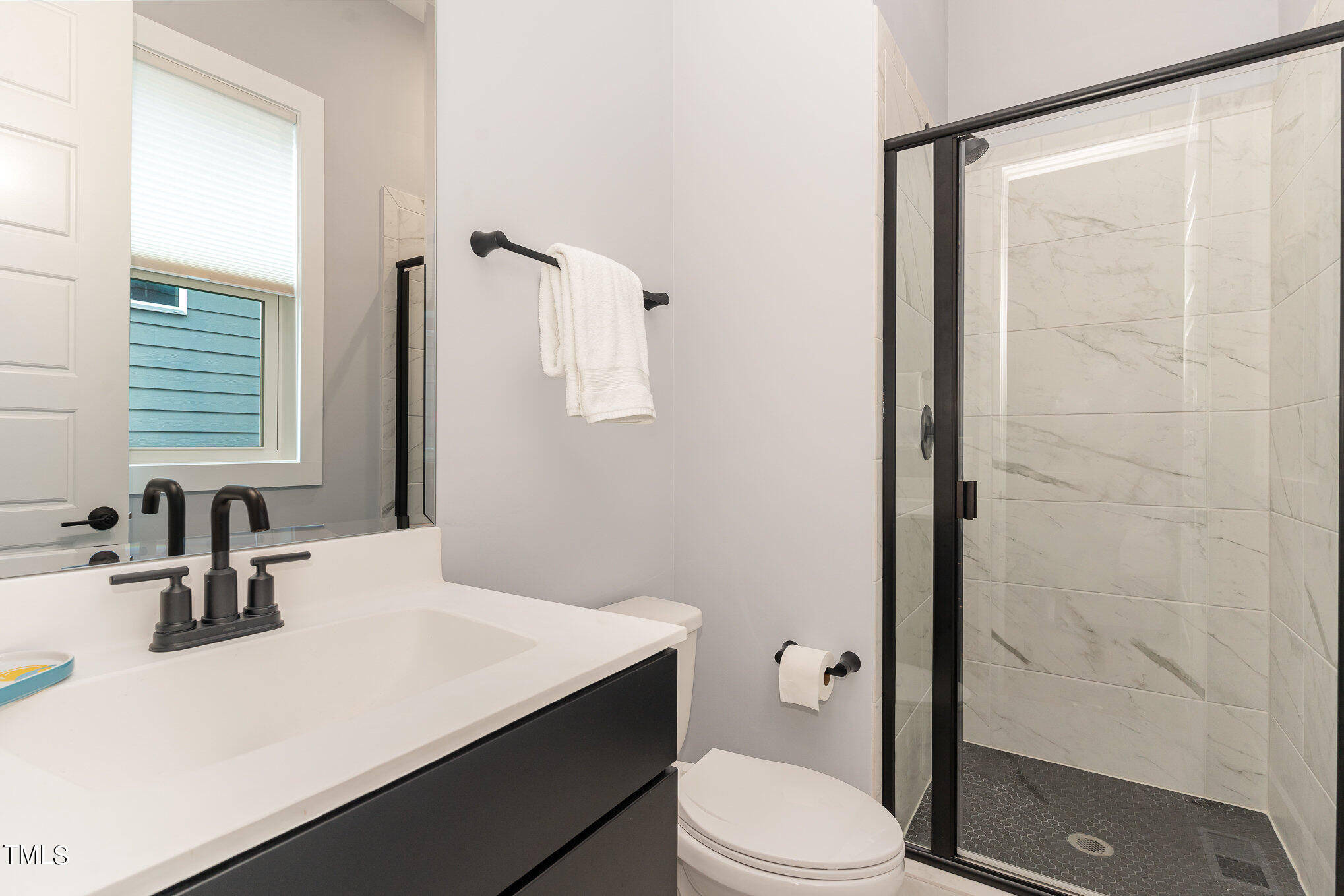 183 Post Oak Road Chapel Hill, NC 27516 - Photo 17 of 51 a bathroom with a sink a toilet and shower
