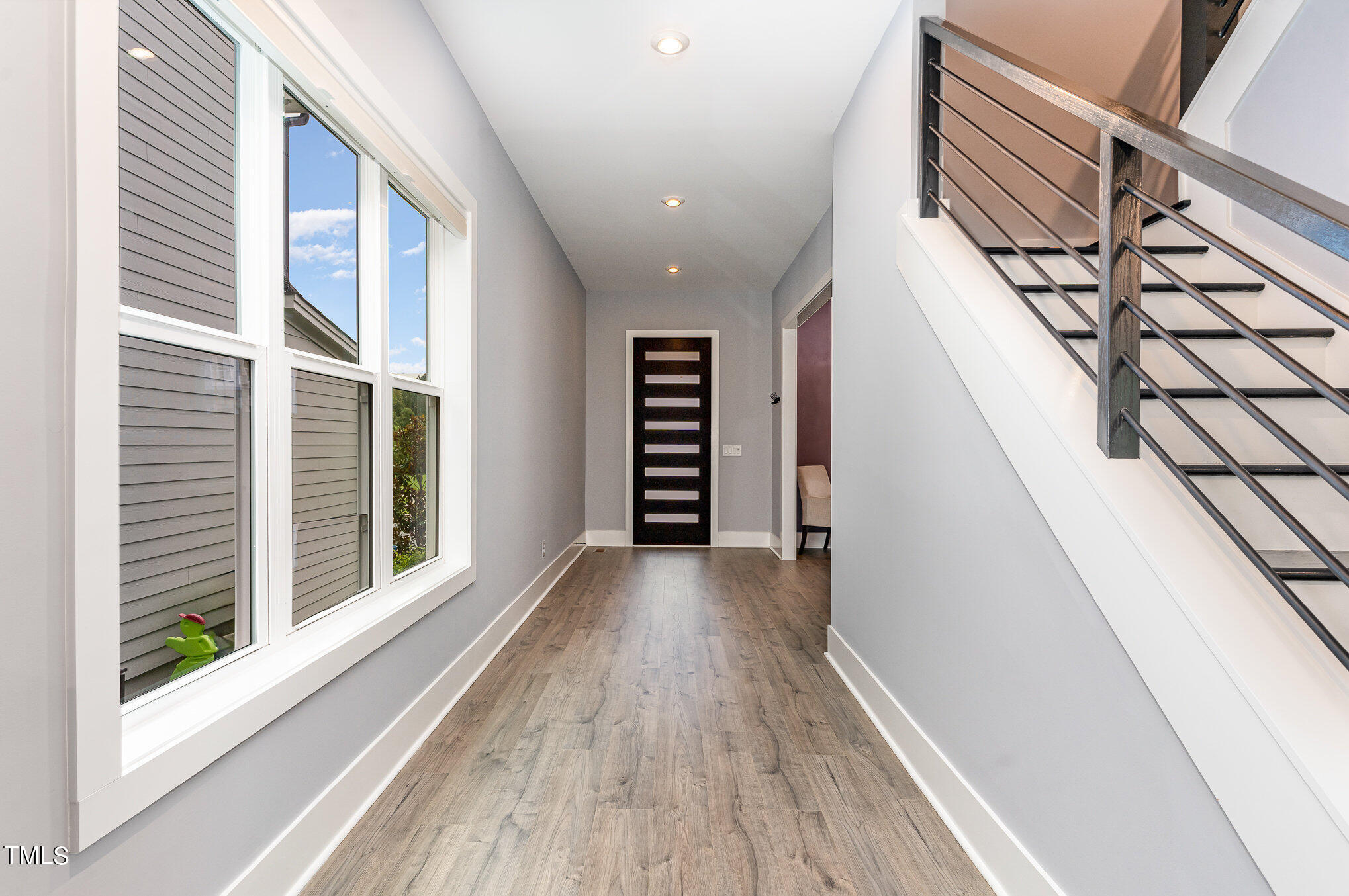 183 Post Oak Road Chapel Hill, NC 27516 - Photo 20 of 51 a view of a hallway with wooden floor and staircase