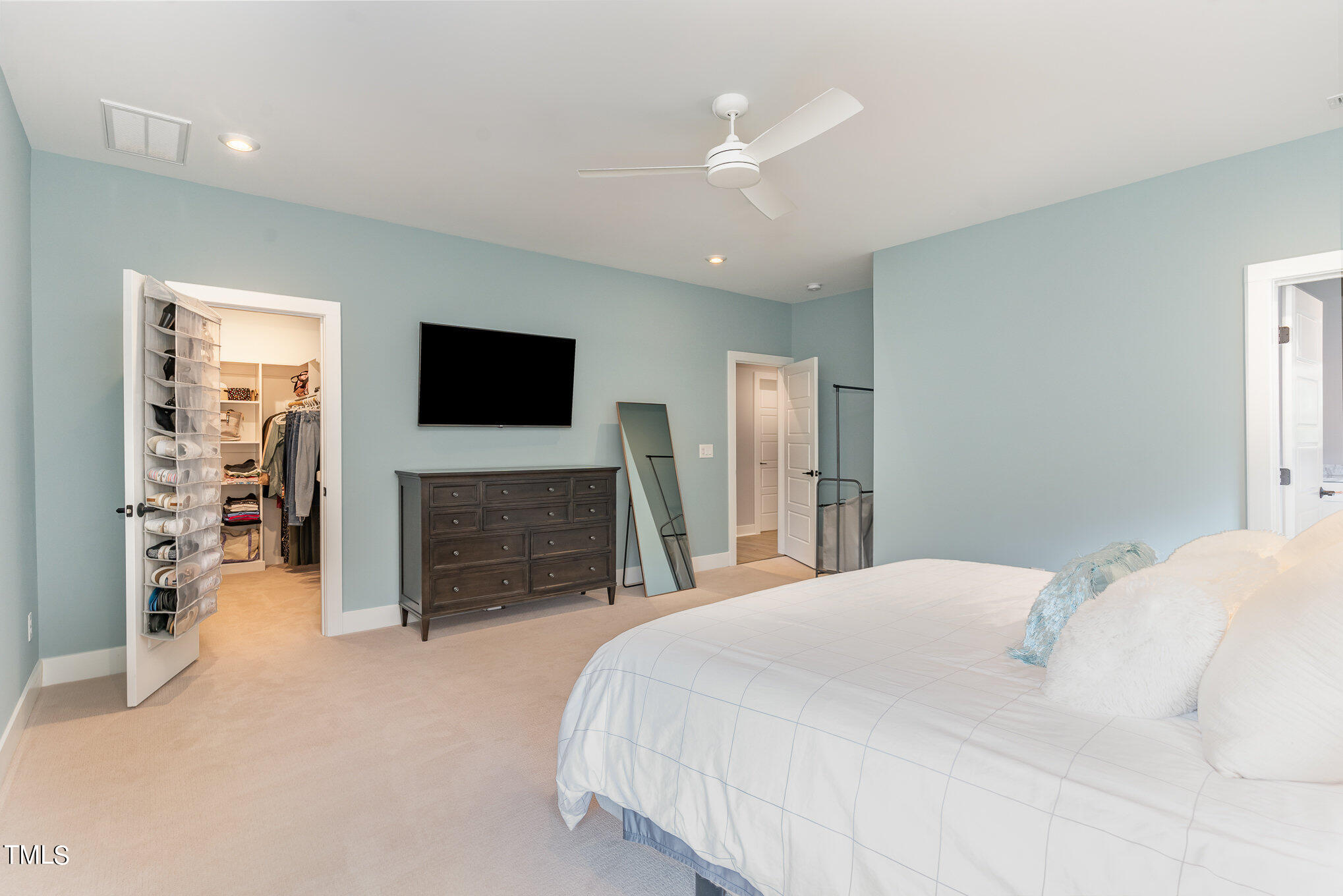 183 Post Oak Road Chapel Hill, NC 27516 - Photo 21 of 51 a spacious bedroom with a bed and a flat screen tv