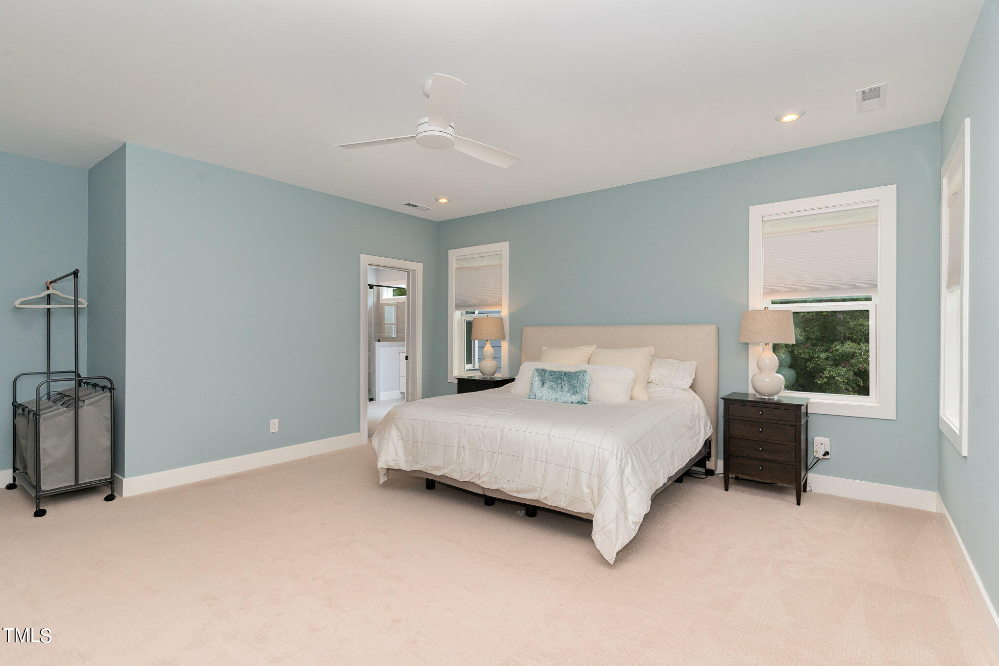 183 Post Oak Road Chapel Hill, NC 27516 - Photo 23 of 51 a bedroom with a bed lamp and a large window