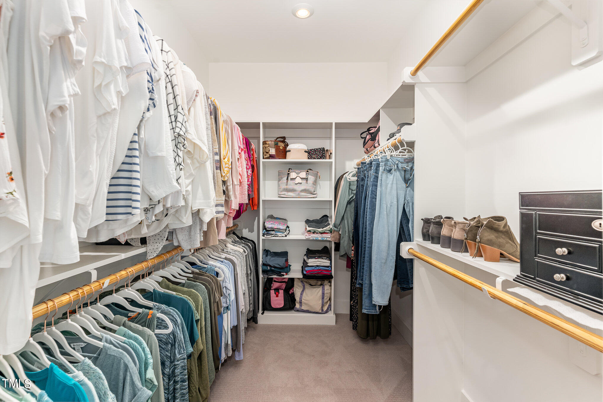 183 Post Oak Road Chapel Hill, NC 27516 - Photo 26 of 51 a view of walk in closet with clothes and shoes
