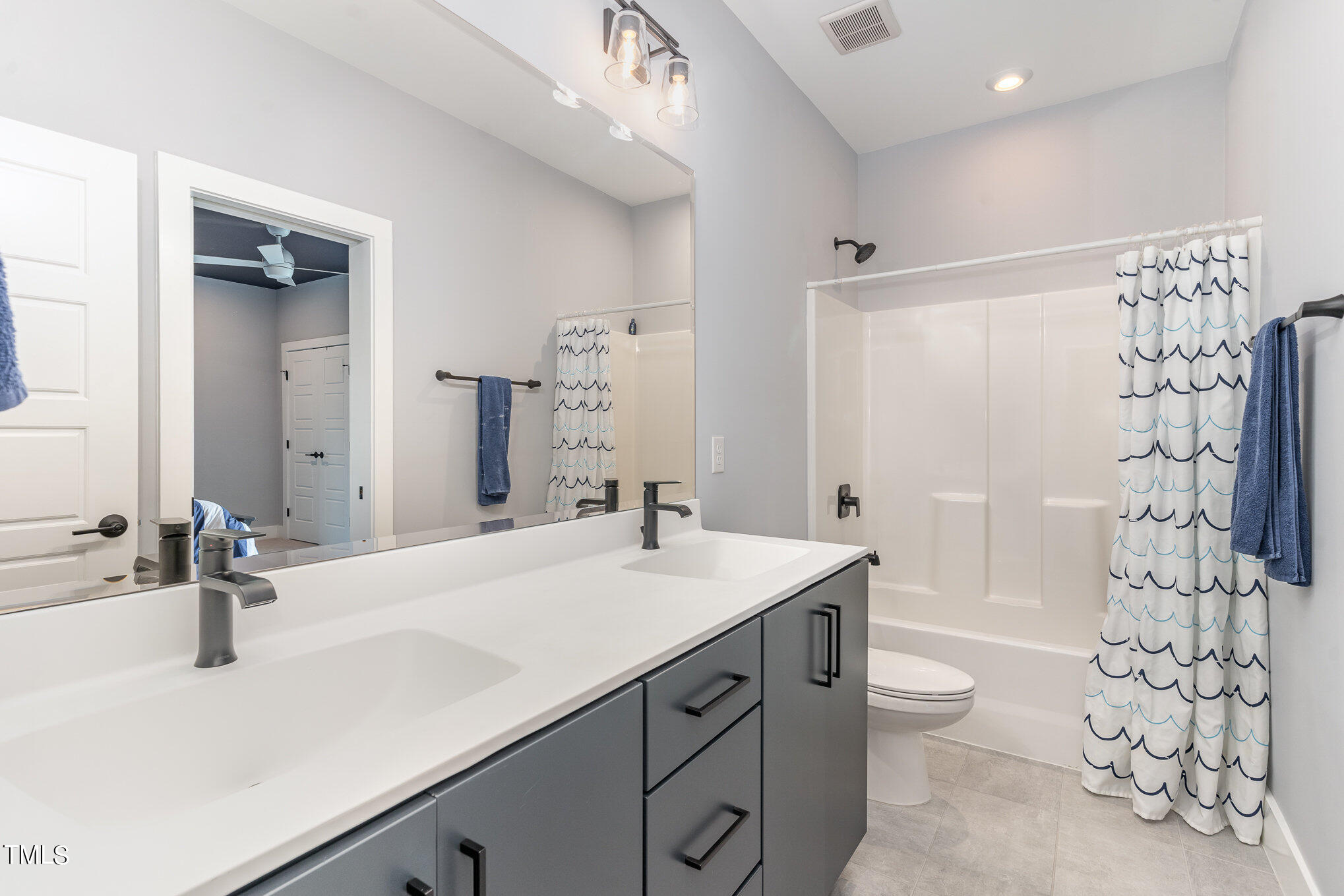 183 Post Oak Road Chapel Hill, NC 27516 - Photo 32 of 51 a bathroom with a sink toilet double vanity and shower