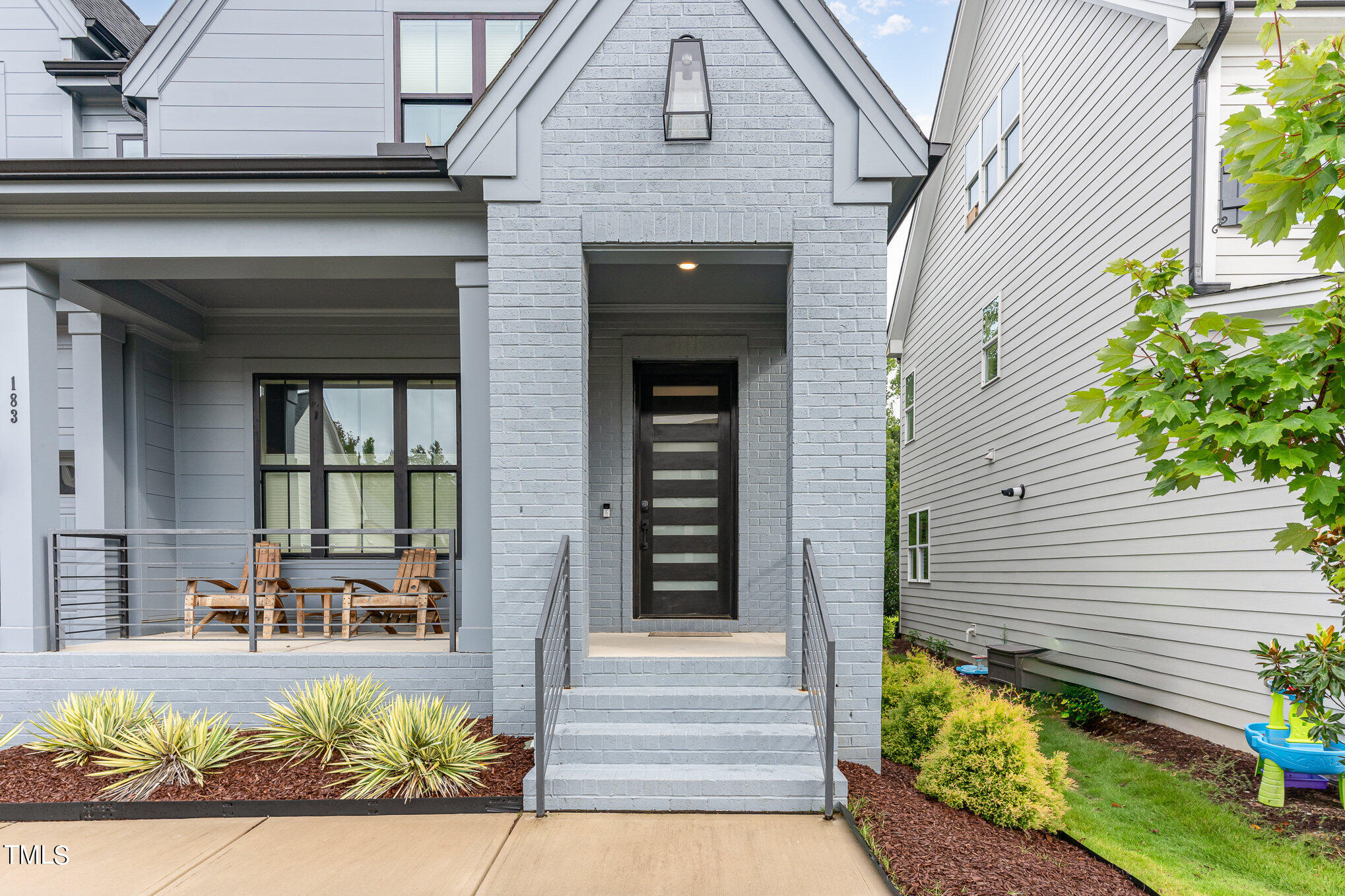 183 Post Oak Road Chapel Hill, NC 27516 - Photo 4 of 51 a front view of a house with a outdoor seating