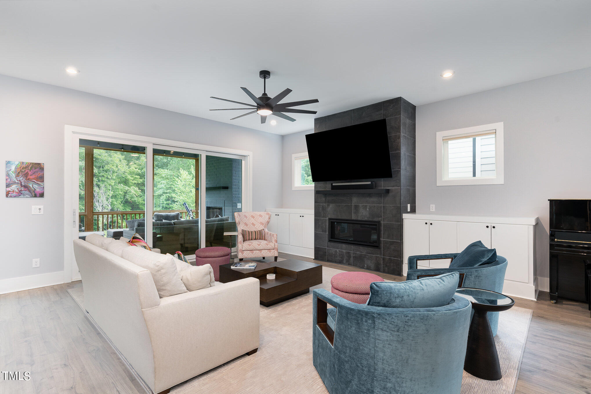 183 Post Oak Road Chapel Hill, NC 27516 - Photo 7 of 51 a living room with furniture a fireplace and a flat screen tv