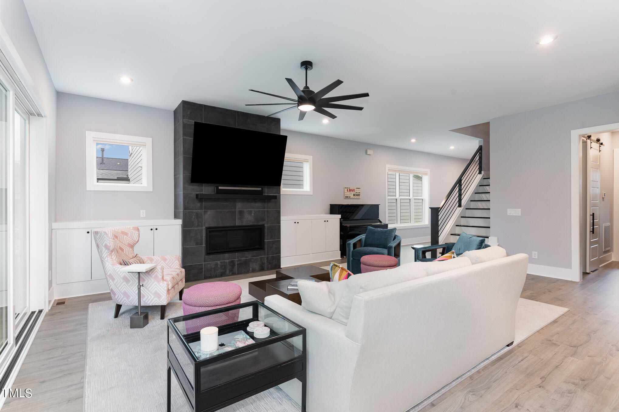 183 Post Oak Road Chapel Hill, NC 27516 - Photo 8 of 51 a living room with furniture a flat screen tv and a fireplace