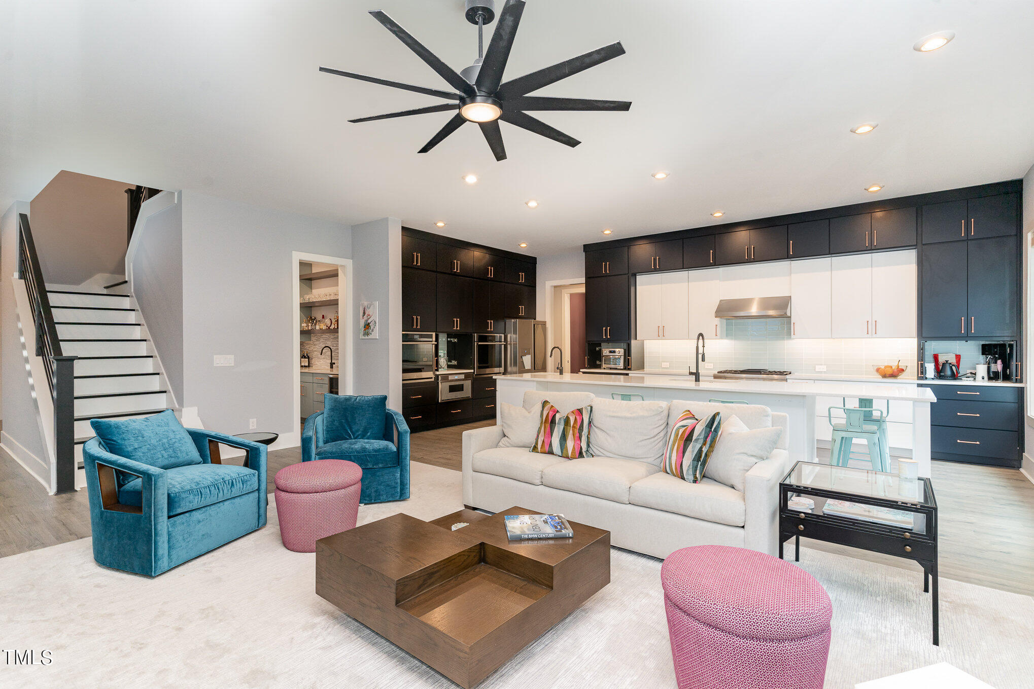 183 Post Oak Road Chapel Hill, NC 27516 - Photo 10 of 51 a living room with furniture ceiling fan and a rug