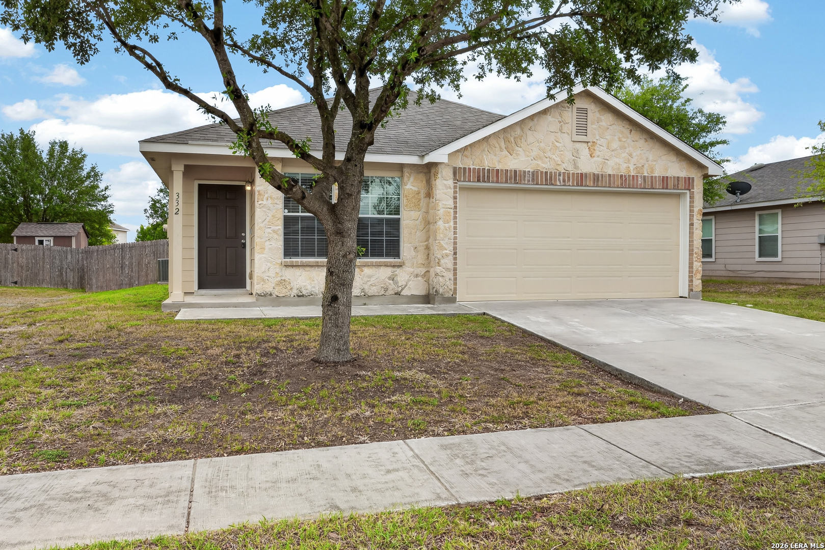 332 Lonestar Gait Selma, TX 78154 - Photo 1 of 24 a front view of a house with a yard and garage