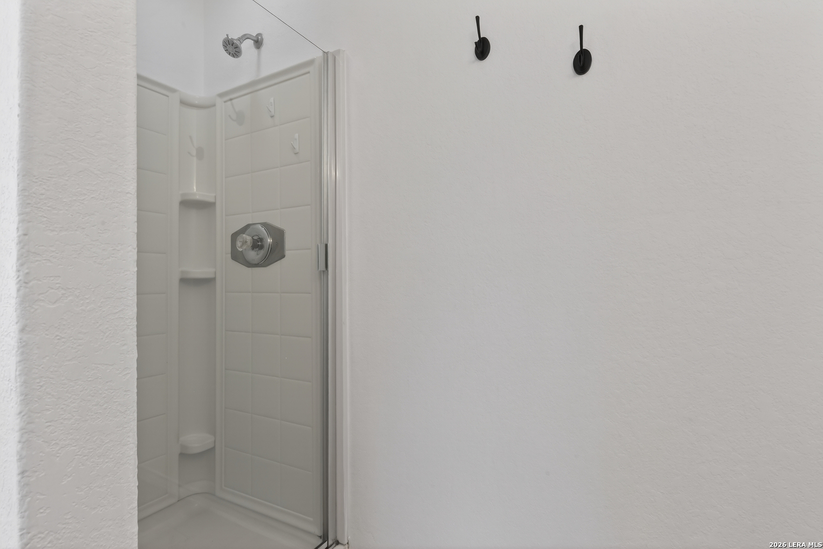 332 Lonestar Gait Selma, TX 78154 - Photo 13 of 24 a bathroom with a shower