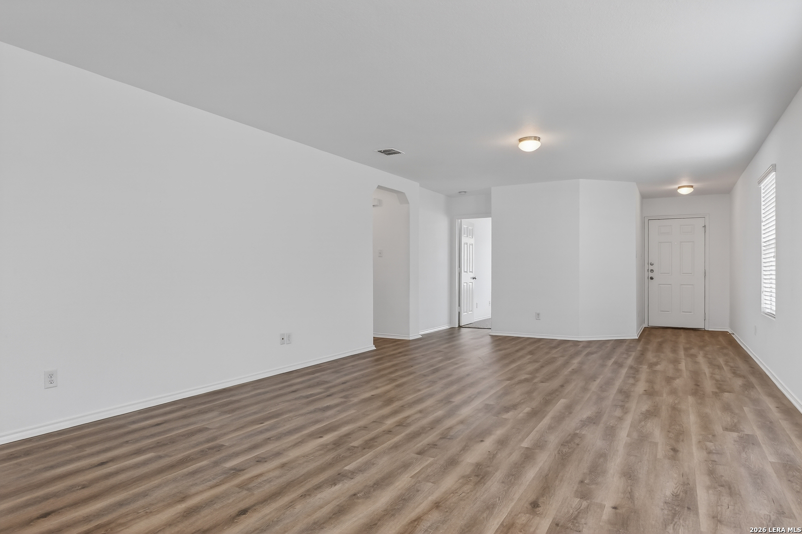 332 Lonestar Gait Selma, TX 78154 - Photo 2 of 24 a view of empty room with wooden floor