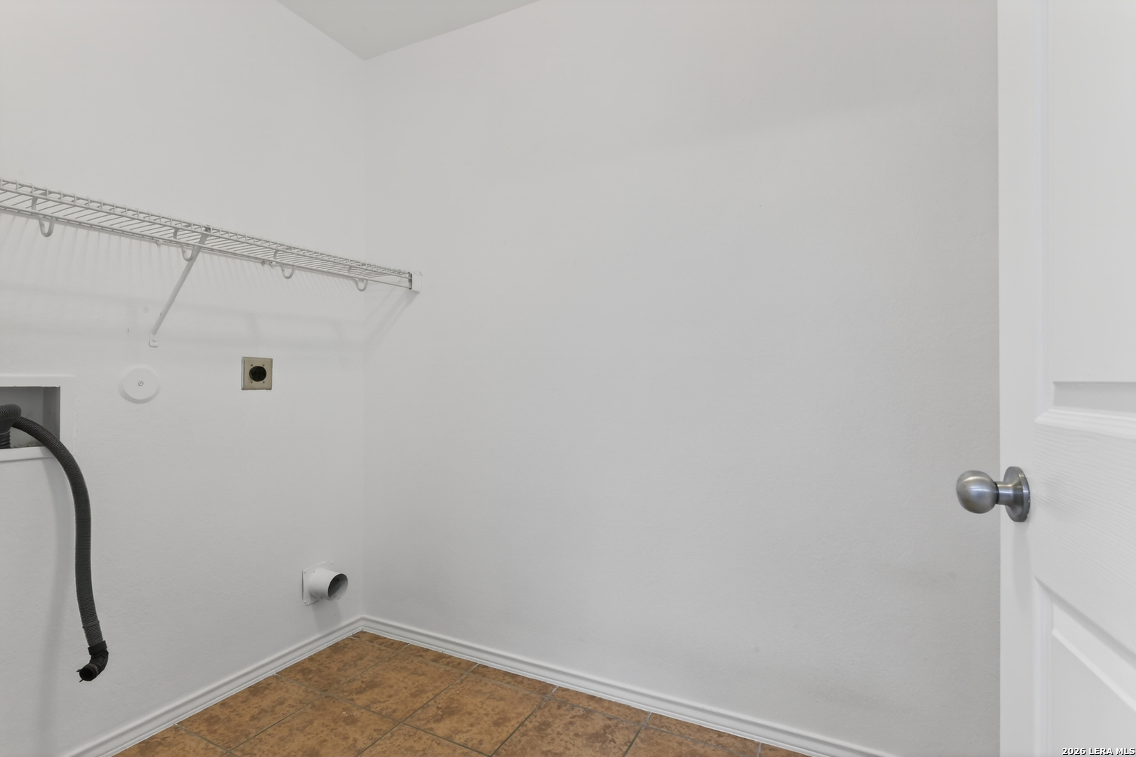 332 Lonestar Gait Selma, TX 78154 - Photo 9 of 24 a view of a room with rack on the wall