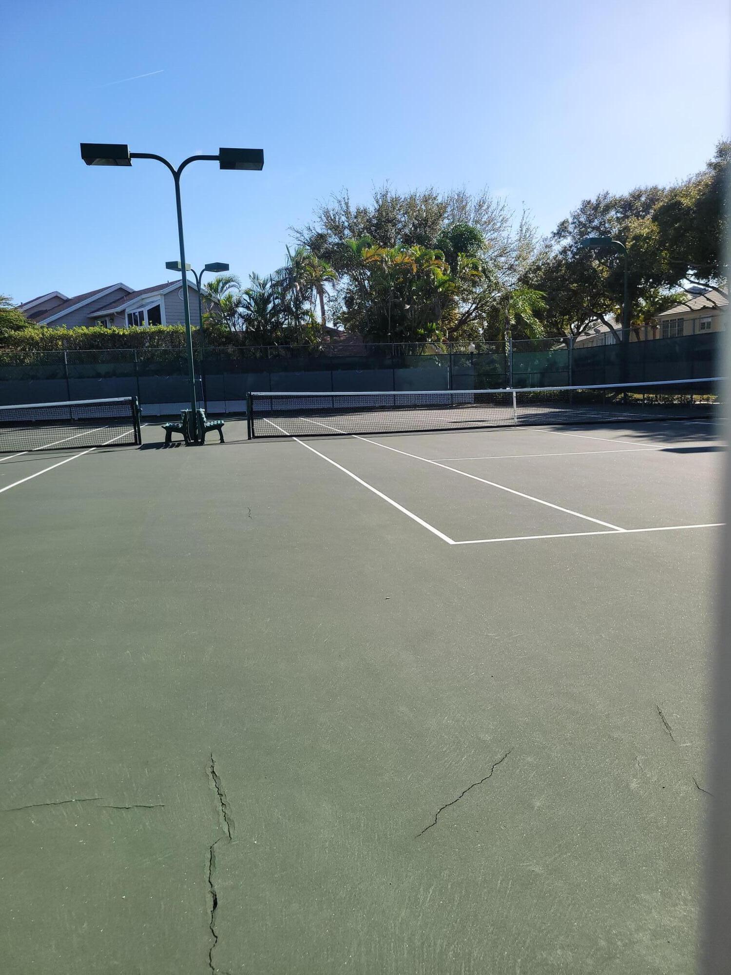 5321 Buckhead Circle, Unit 1020 Boca Raton, FL 33431 - Photo 13 of 13 a view of a tennis court