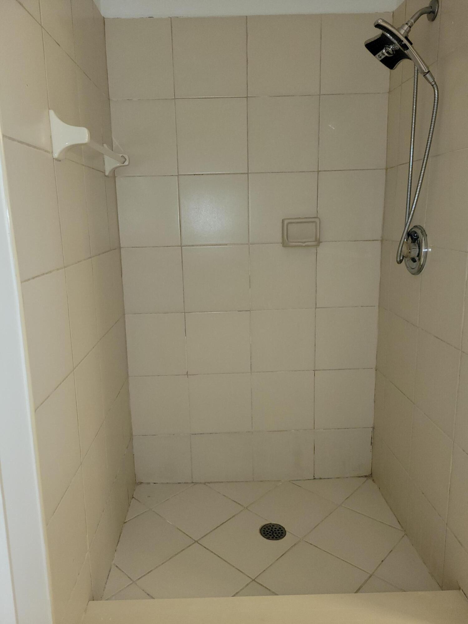 5321 Buckhead Circle, Unit 1020 Boca Raton, FL 33431 - Photo 8 of 13 a bathroom with a shower