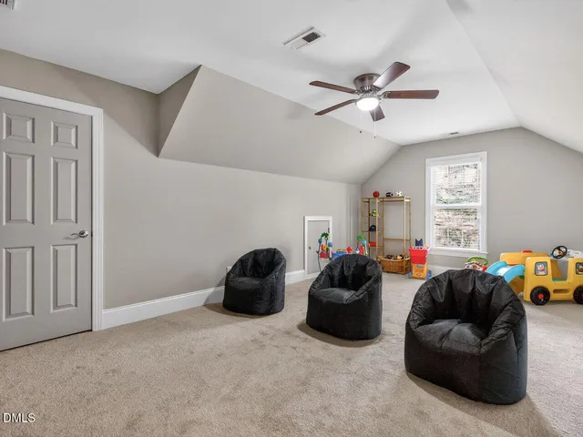 a living room with furniture a couch and a window