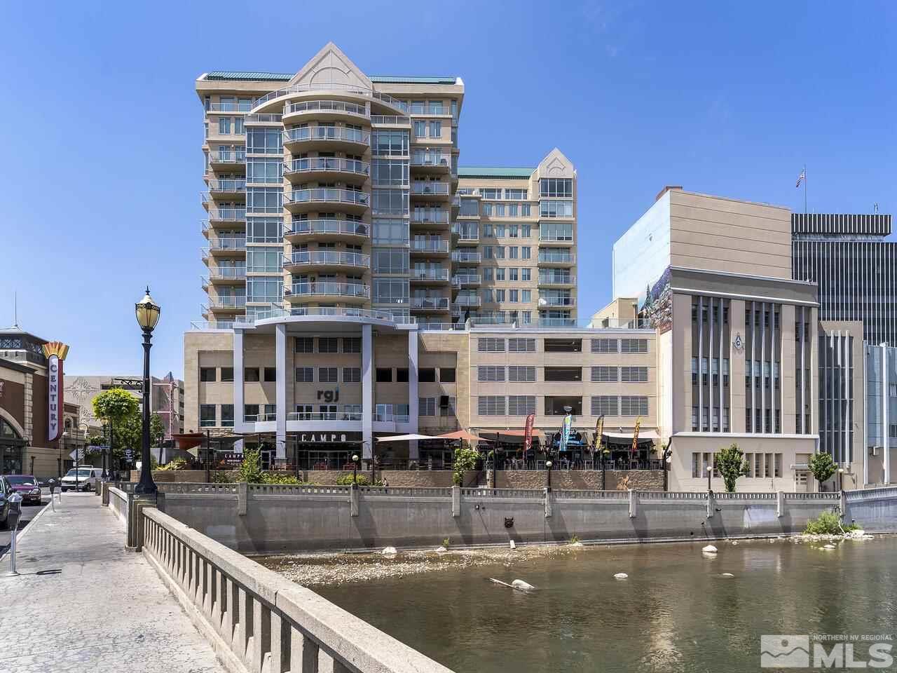 a view of a tall building with a swimming pool