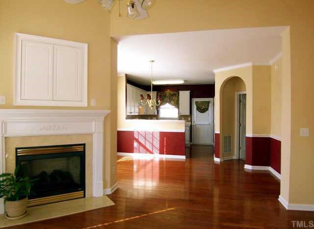 4716 Delta Vision Court Raleigh, NC 27612 - Photo 4 of 12 With cabinets over the gas fireplace you have the option of placing a large television in an out-of the way location!