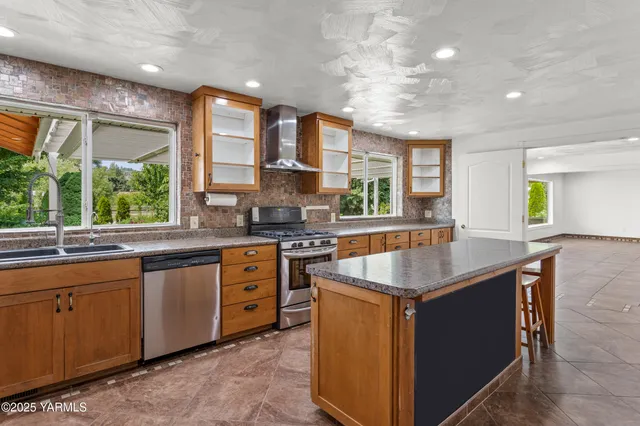 a kitchen with sink cabinets and refrigerator