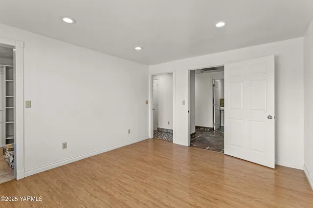 a view of an empty walk in closet