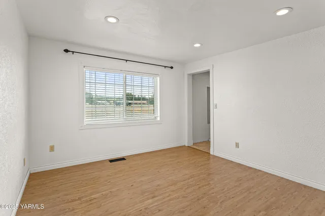 a view of a room with furniture and front door