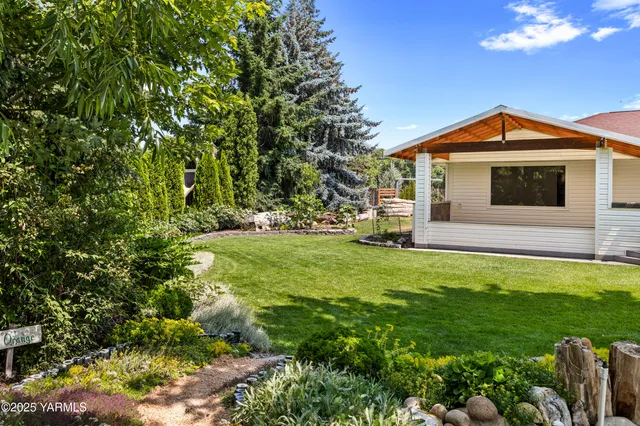 a backyard of a house with lots of green space