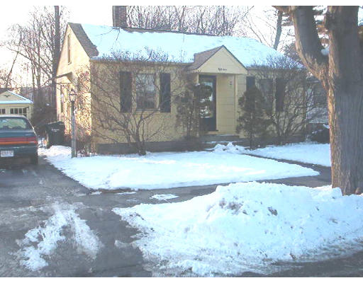 54 Gilman Street Springfield, MA 01118 - Photo 1 of 1 a view of a house with a yard covered in snow