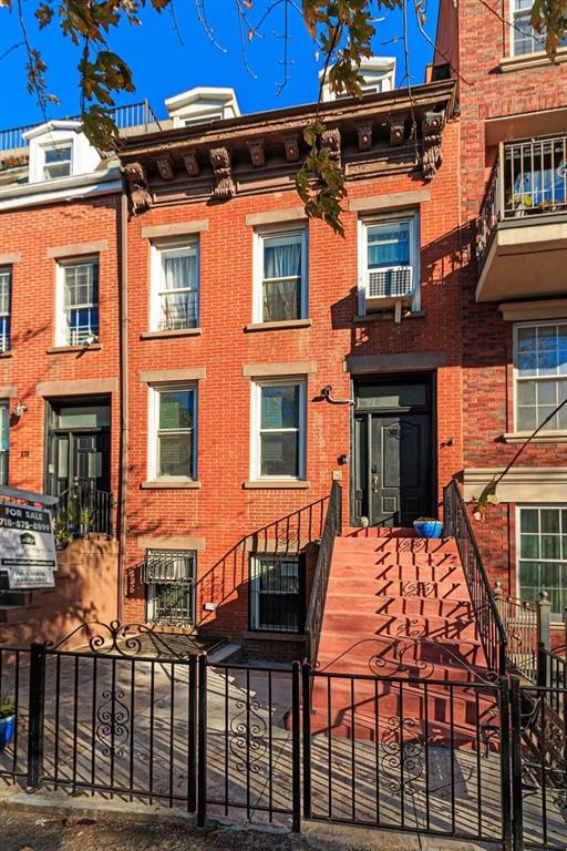 a outdoor view of a house with sitting area