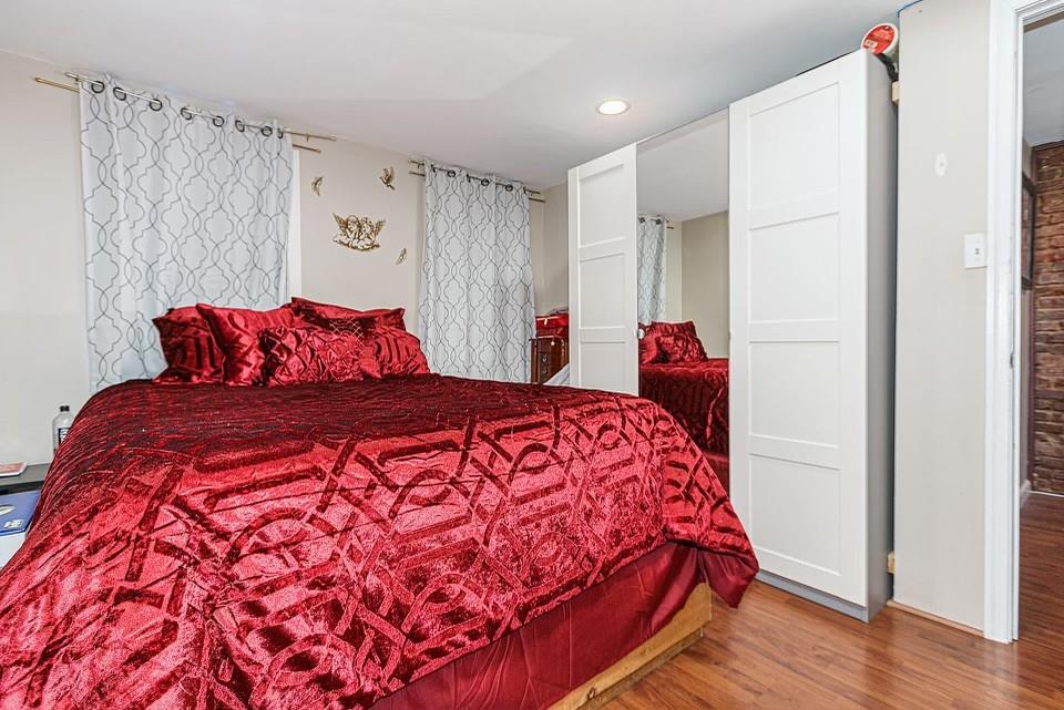 173 12th Street Brooklyn, NY 11215 - Photo 12 of 20 a bedroom with a bed and a closet