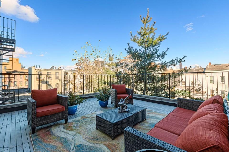 173 12th Street Brooklyn, NY 11215 - Photo 14 of 20 a view of a patio with couches chairs dining table and chairs