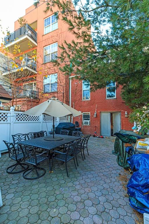 173 12th Street Brooklyn, NY 11215 - Photo 15 of 20 a view of a patio with table and chairs and potted plants