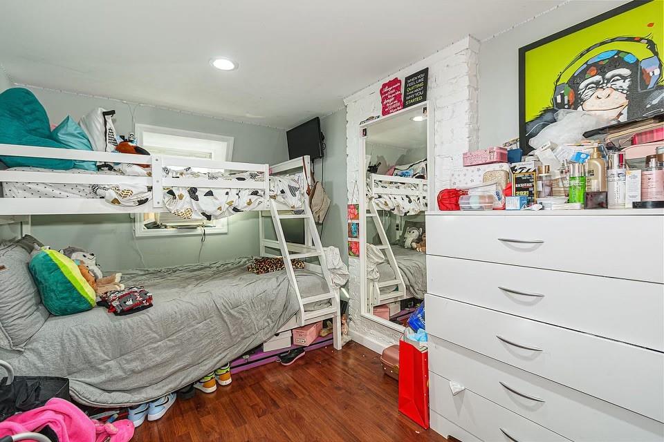 173 12th Street Brooklyn, NY 11215 - Photo 20 of 20 a living room with a couch and dresser