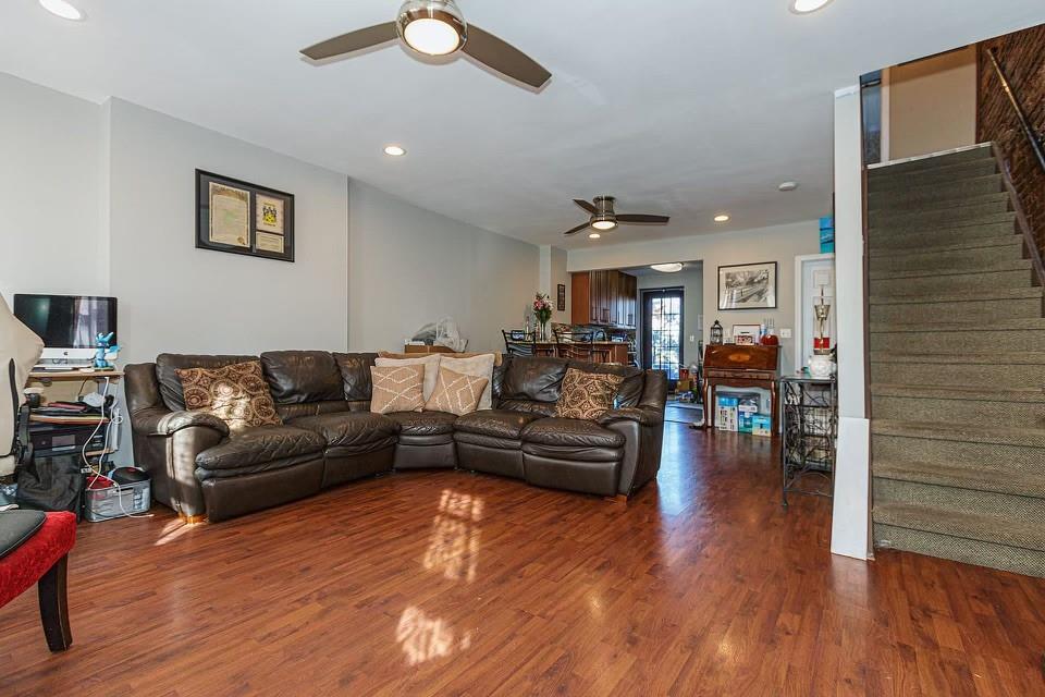 173 12th Street Brooklyn, NY 11215 - Photo 3 of 20 a living room with furniture and wooden floor
