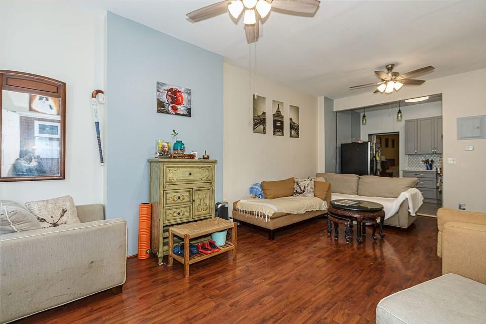173 12th Street Brooklyn, NY 11215 - Photo 5 of 20 a living room with furniture and wooden floor
