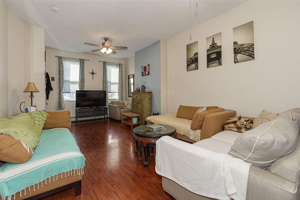 173 12th Street Brooklyn, NY 11215 - Photo 6 of 20 a living room with furniture and a fireplace