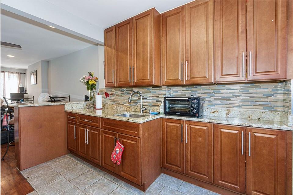 173 12th Street Brooklyn, NY 11215 - Photo 8 of 20 a kitchen with stainless steel appliances granite countertop a sink stove and cabinets