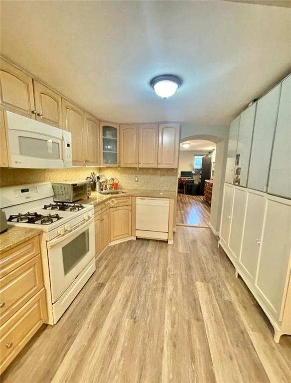 173 12th Street Brooklyn, NY 11215 - Photo 10 of 20 a kitchen with a stove a sink and a refrigerator