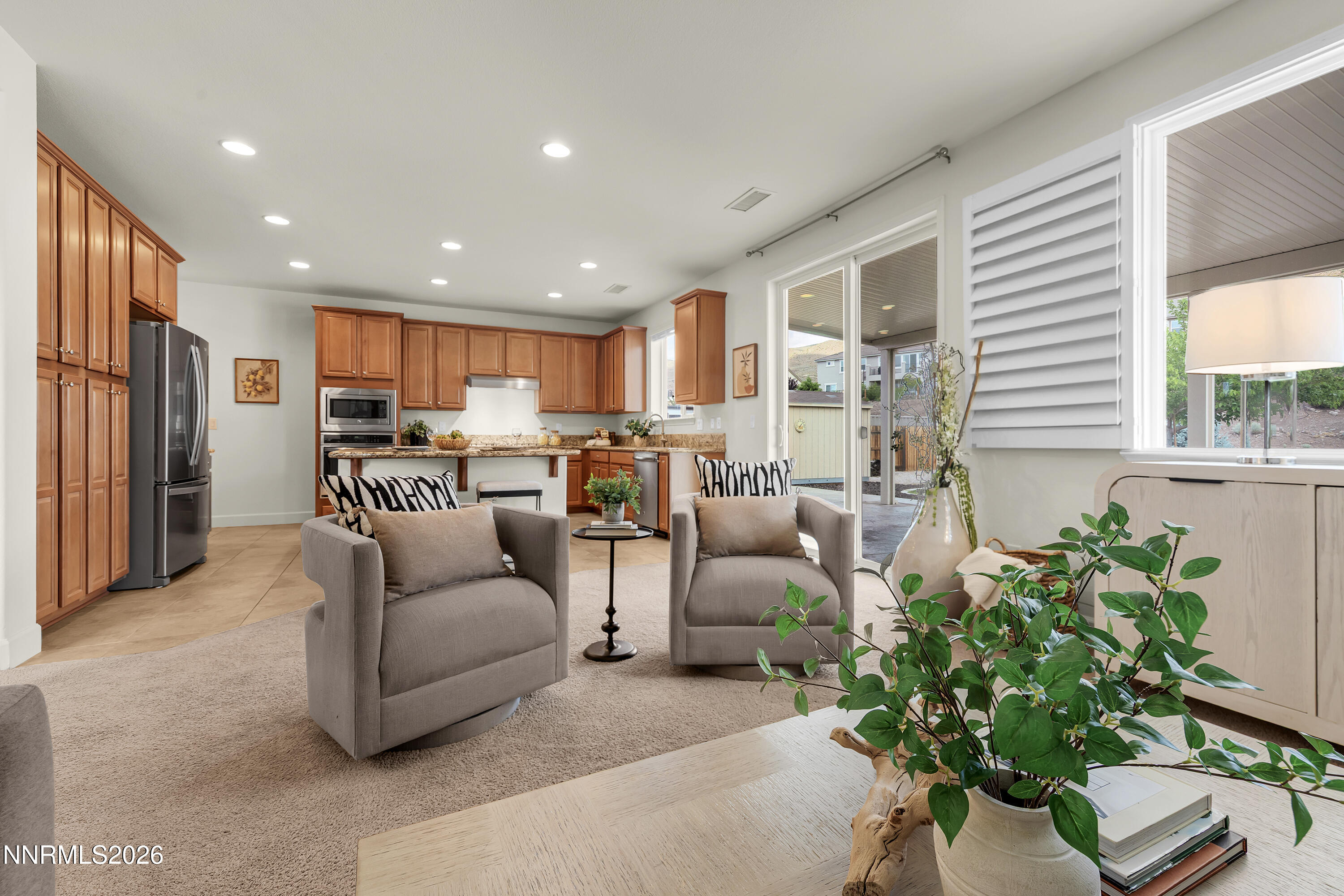 10150 Barrel Racer Drive Reno, NV 89521 - Photo 20 of 64 a living room with furniture and a potted plant