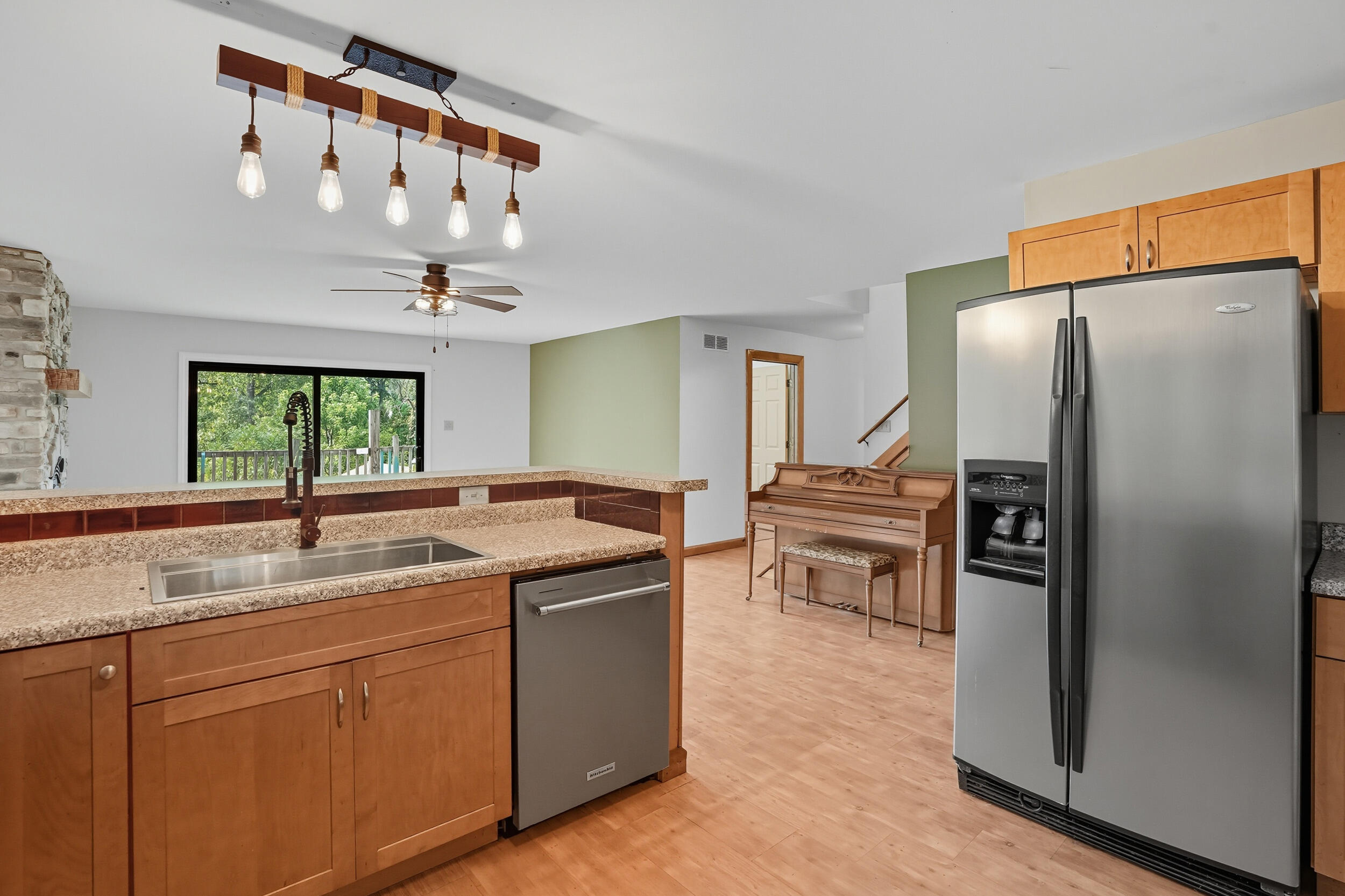450 East Greening Road Chesterton, IN 46304 - Photo 11 of 56 a kitchen with stainless steel appliances granite countertop a sink a refrigerator and a granite counter tops