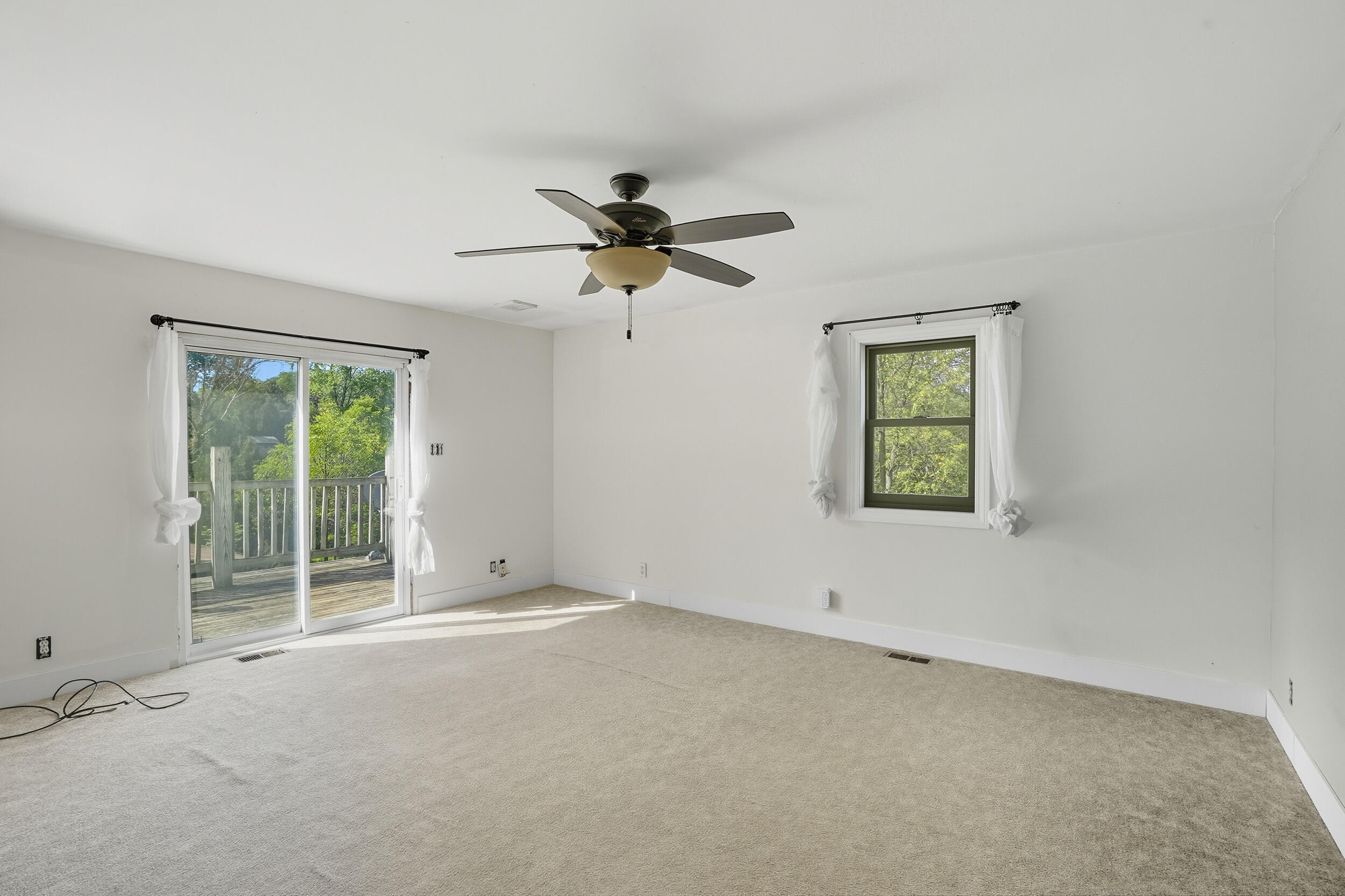 450 East Greening Road Chesterton, IN 46304 - Photo 15 of 56 an empty room with a window and a fan