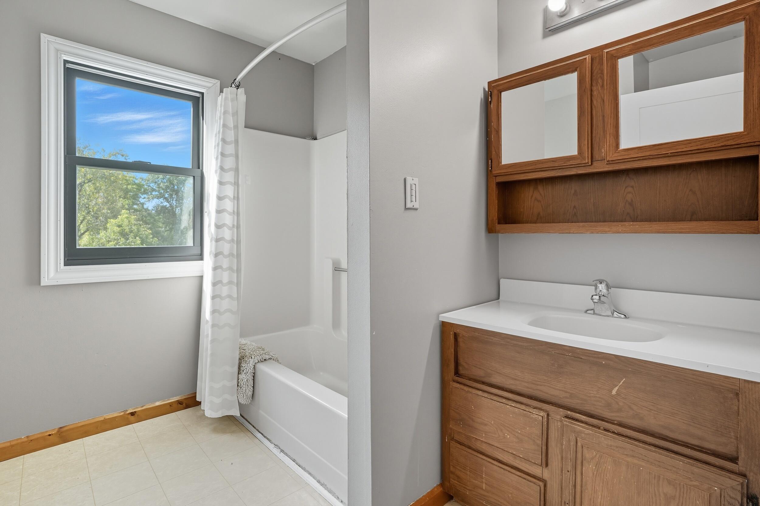 450 East Greening Road Chesterton, IN 46304 - Photo 19 of 56 a bathroom with a sink and a mirror