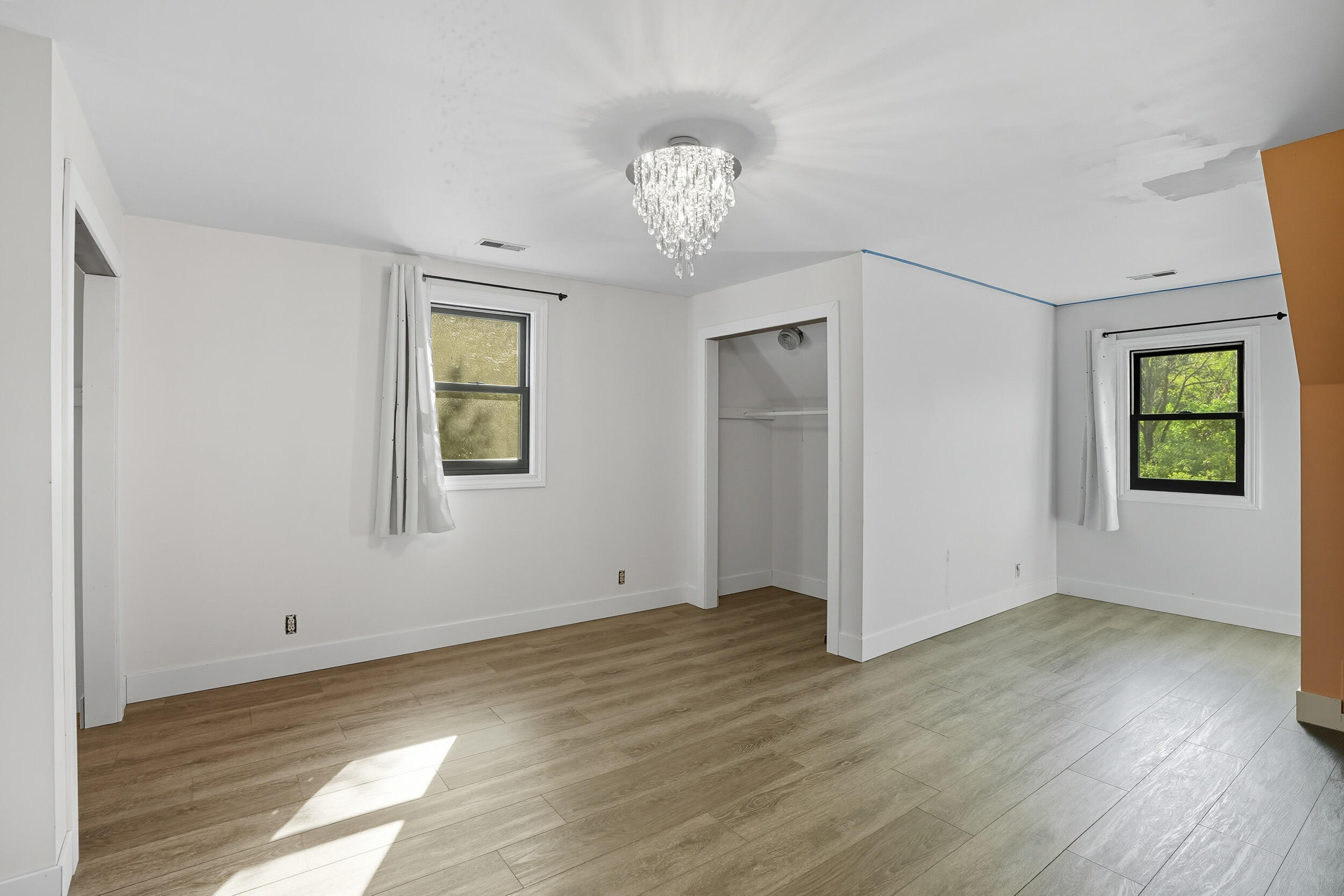 450 East Greening Road Chesterton, IN 46304 - Photo 21 of 56 a view of an empty room with wooden floor and a window