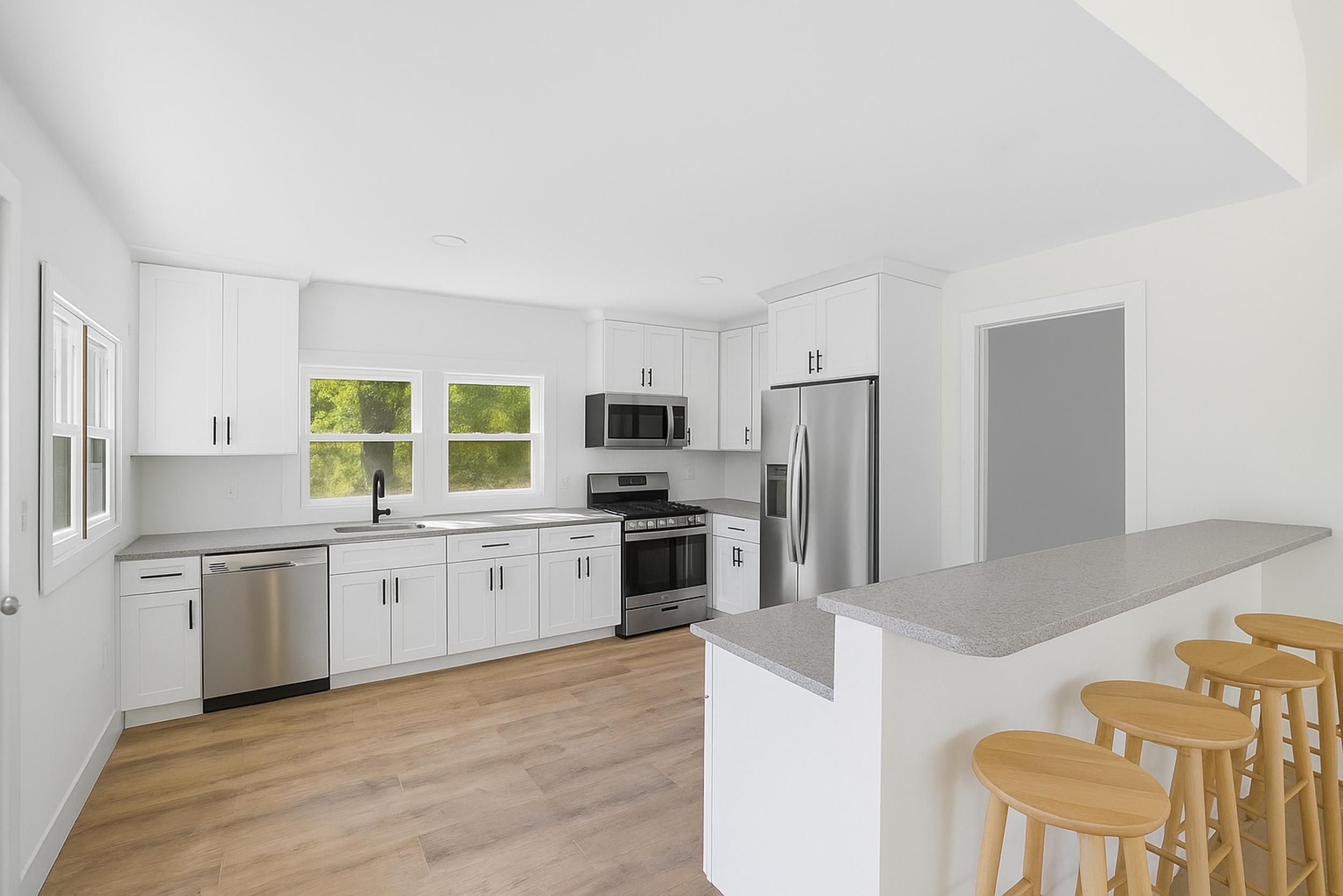 450 East Greening Road Chesterton, IN 46304 - Photo 36 of 56 a large kitchen with cabinets wooden floor and stainless steel appliances