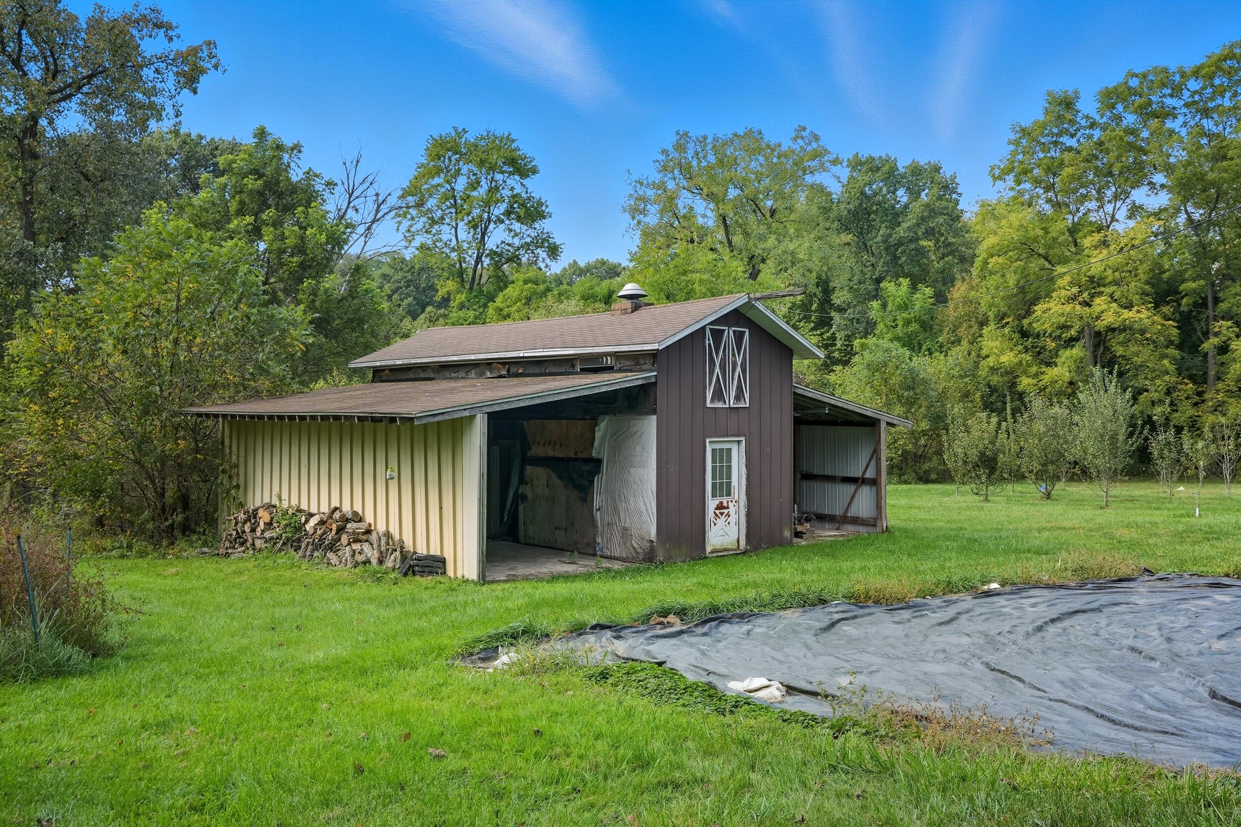 450 East Greening Road Chesterton, IN 46304 - Photo 38 of 56 a front view of a house with garden